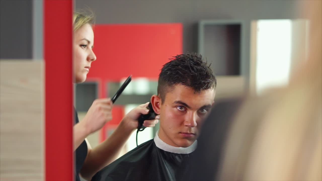 Haircut in progress at a barbershop
