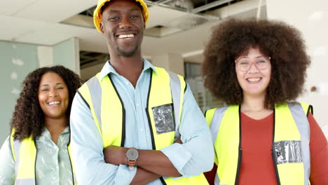 Portrait-of-smiling-casual-diverse-architects-working-in-office,-slow-motion-with-copy-space