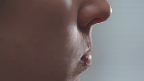 woman swishing water in mouth. close up