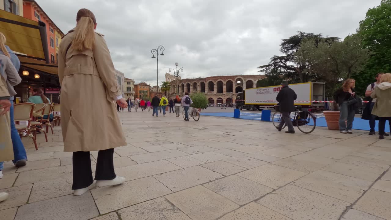 Timelapse of Piazza Bra in Verona with Arena and tourists, static daytime shot