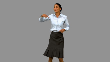 Businesswoman-disco-dancing-on-grey-screen-