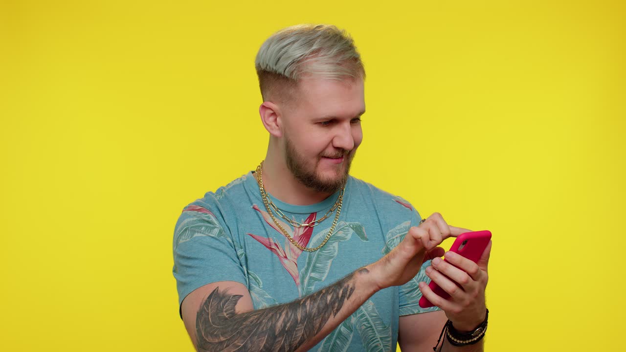 Tourist man using mobile phone typing post on web sms message browsing addiction of social networks