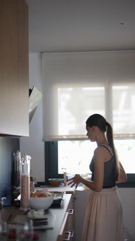 young woman cooking in modern kitchen