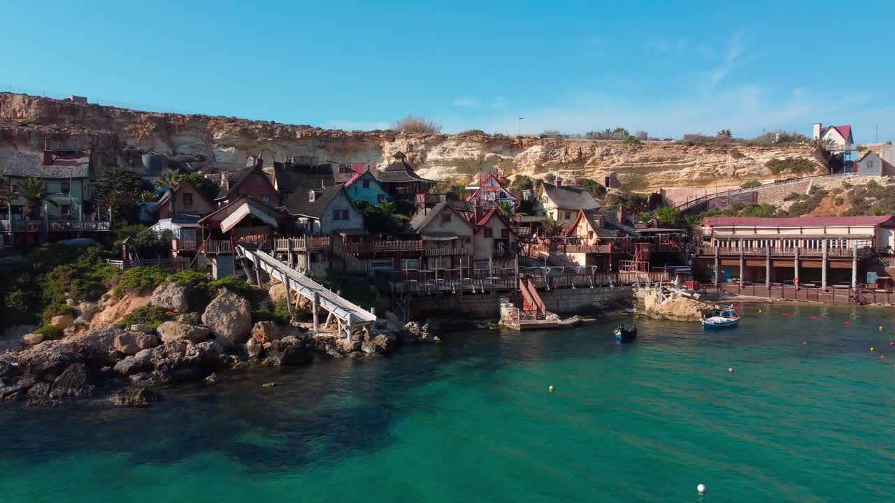 Picturesque mediterranean Popeye village in Malta. Aerial dolly outt