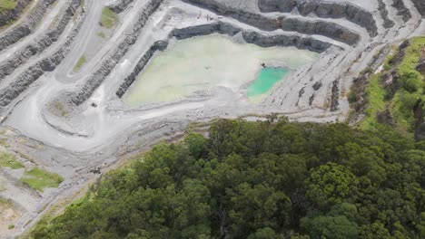 aerial footage of quarry with visible water pools