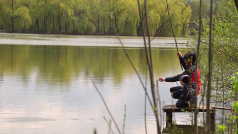 two brothers fishing with a fishing rod 01