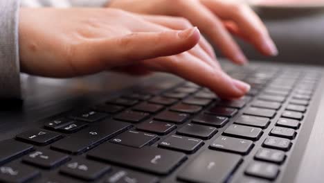 laptop keyboard female hands typing close-up wide angle shot