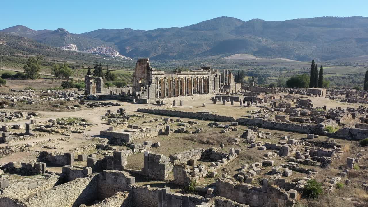 Volubilis, a historic Roman city in Morocco, flourished as a key administrative and trade hub, notable for its mosaics, temples, and remarkably preserved archaeological remains