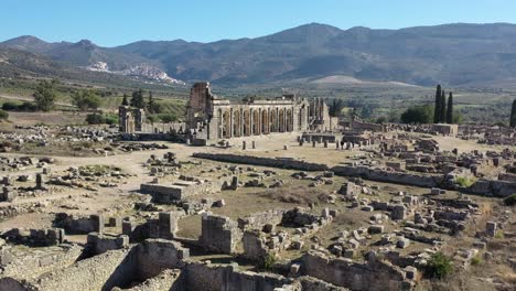 volubilis, a historic roman city in morocco, flourished as a key administrative and trade hub, notable for its mosaics, temples, and remarkably preserved archaeological remains