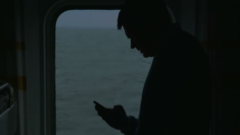 adult man with phone on the cruise ship