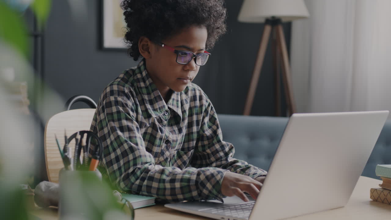 Child Working on a Laptop at Home