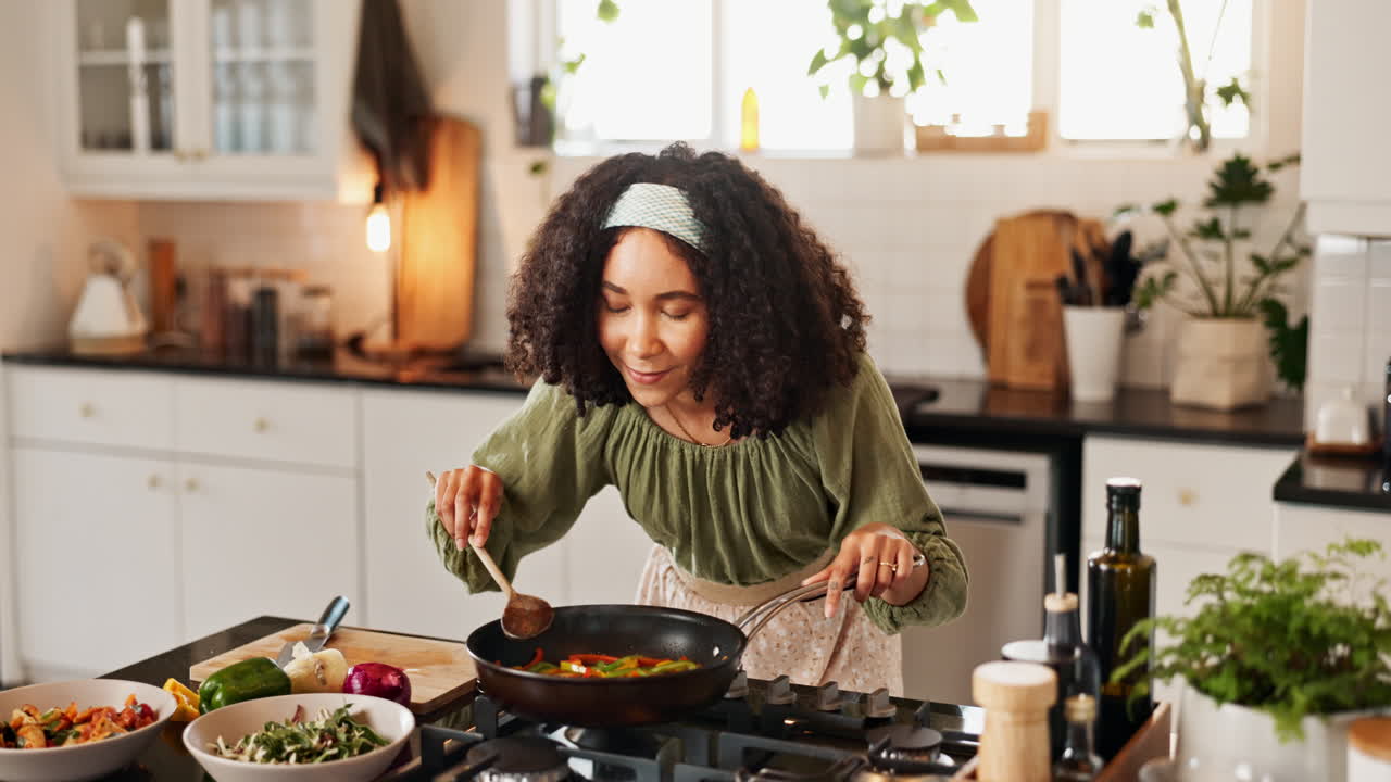Woman Cooking Vegetables in a Kitchen