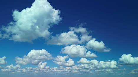 Cloudscape---Blue-sky-and-white-clouds,-wide-panorama