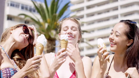 close up portrait teenage girls eating ice cream in the summer on vacation