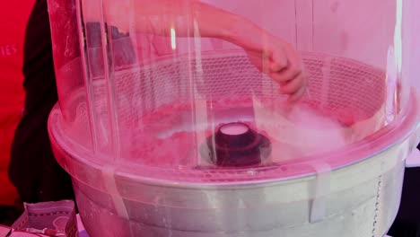 Candy-floss-being-made-with-a-machine-at-a-street-fair-in-England