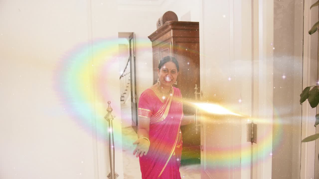 Woman in sari stepping through doorway, gold flash sparking animated rings revealing home decor