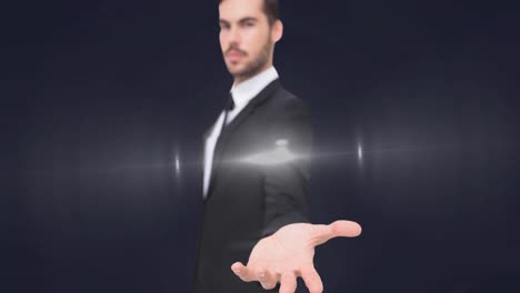 animation of glowing spot of light over businessman hand on grey background