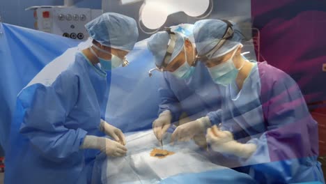 Animation-of-flag-of-france-waving-over-surgeons-in-operating-theatre