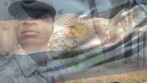 animation of flag of argentina over african american male soldier