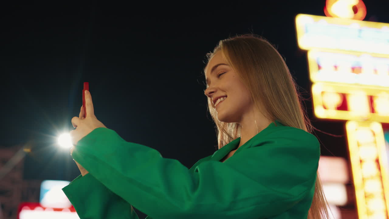 Woman Taking Selfie at Night