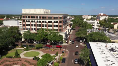 wide aerial establishing of winter park showing green areas, offices, and moving vehicles