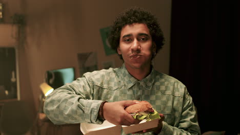 man eating burger