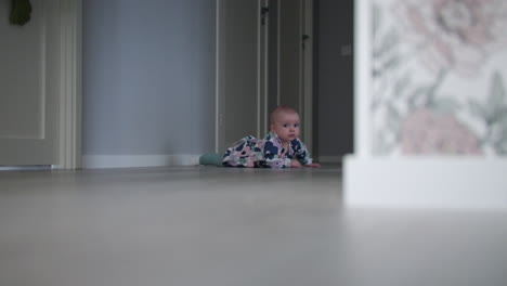 crawling-baby-girl-explores-surroundings-in-family-home---Baby-At-Home-Series