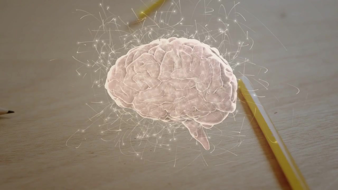 Ologramma di cervello rosa che ruota e scintilla, con matite gialle che passano a mostrare l'attività cerebrale.