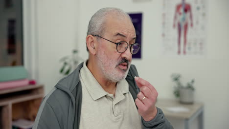 senior man drinking a glass of water