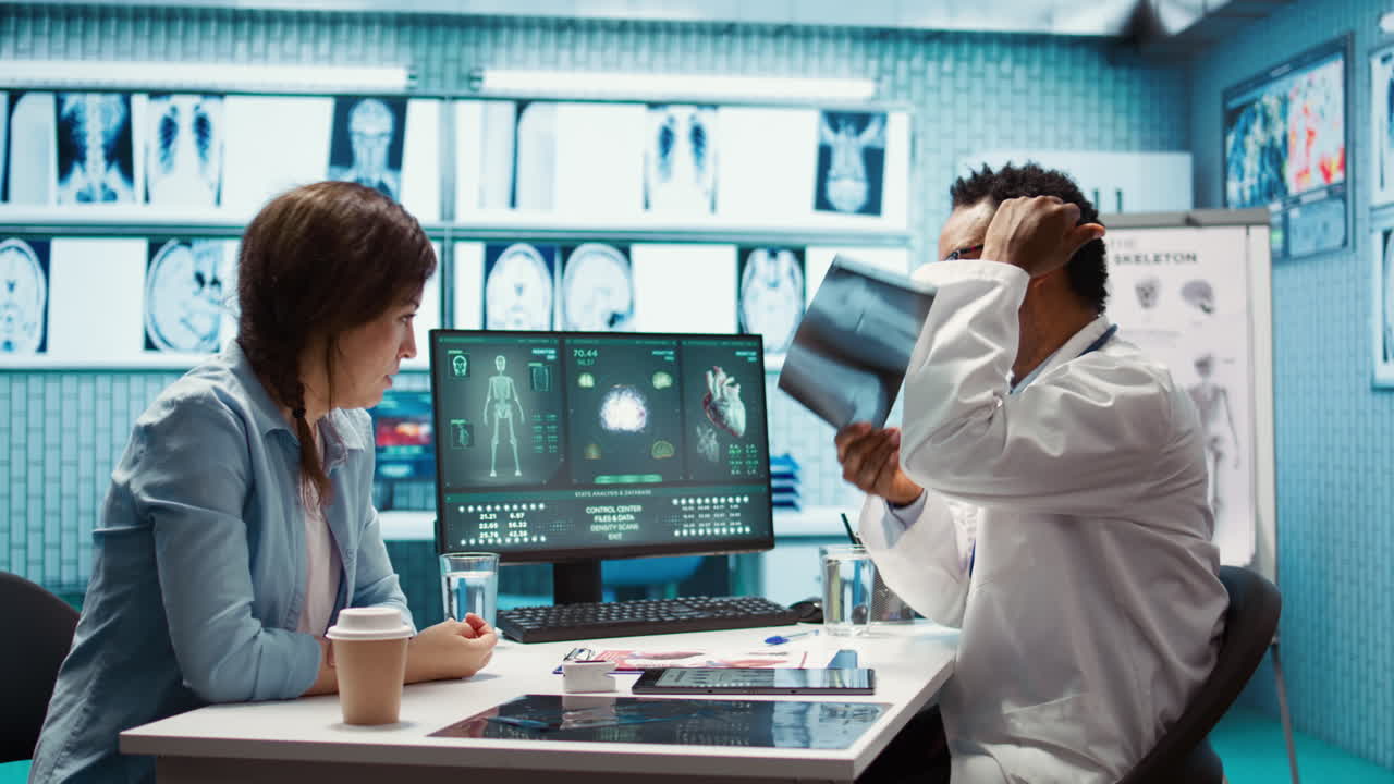 African american physician presenting the x ray diagnostics results to a patient