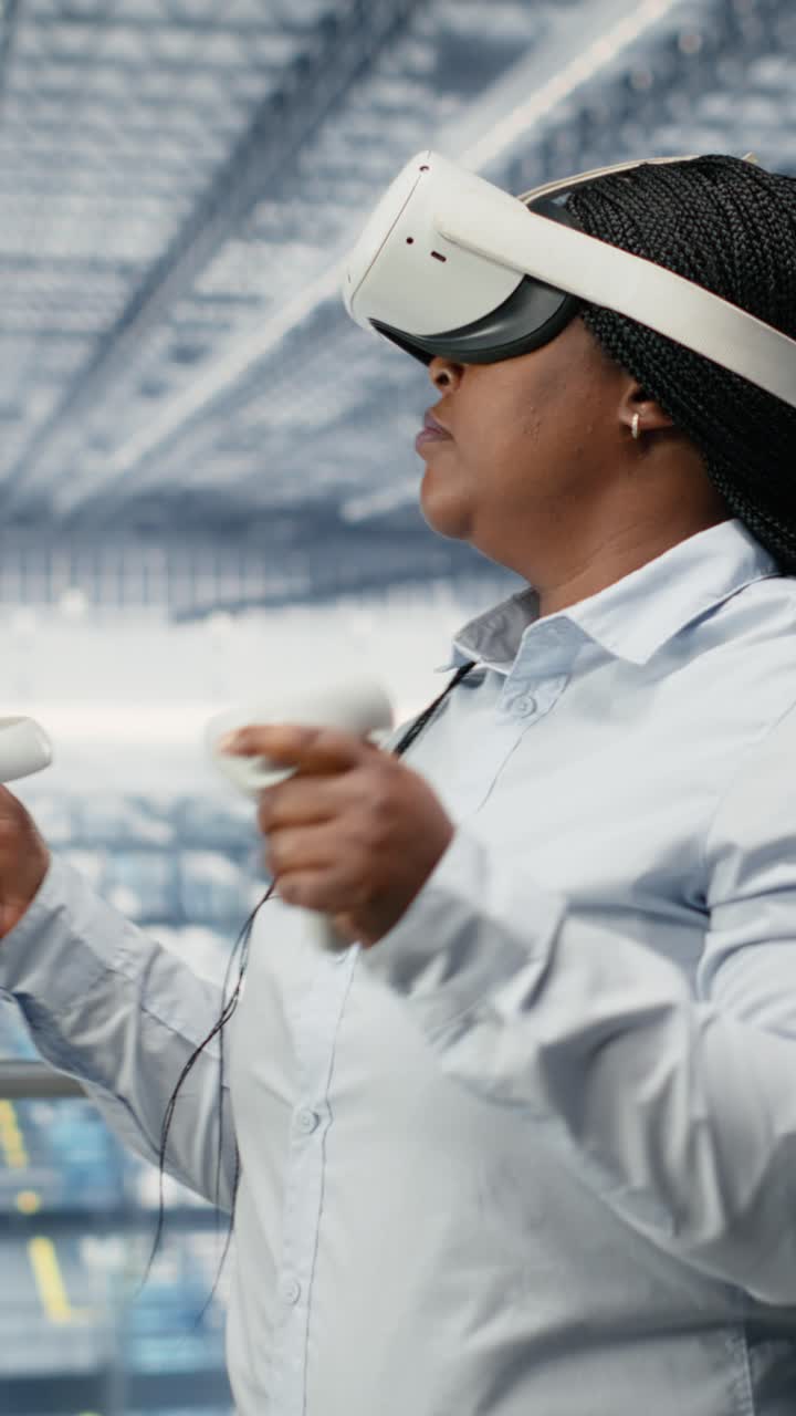 Vertical video Woman reviews microchip factory equipment diagnostic readouts using VR
