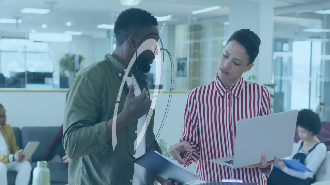 Animation of changing numbers and circles over multiracial coworkers discussing reports in office