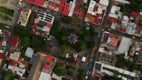 top down view of ajijic main square in jalisco, mexico. drone ascending orbit, top-down view