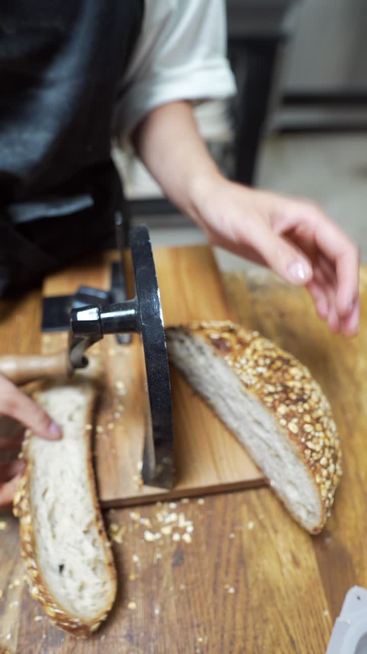 Baker Slicing Artisan Bread
