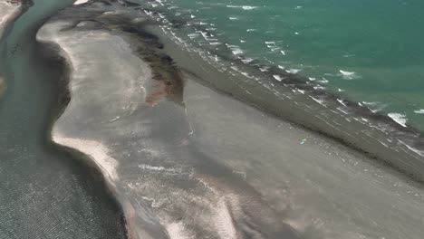 High-angle-drone-view-of-two-kites-on-beach-in-Northeastern-Brazil