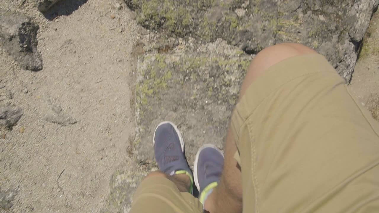 Person Hiking on Rocks