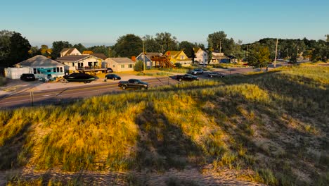 aerial motion, drone descending toward beach town