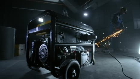 construction site at night with worker and generator