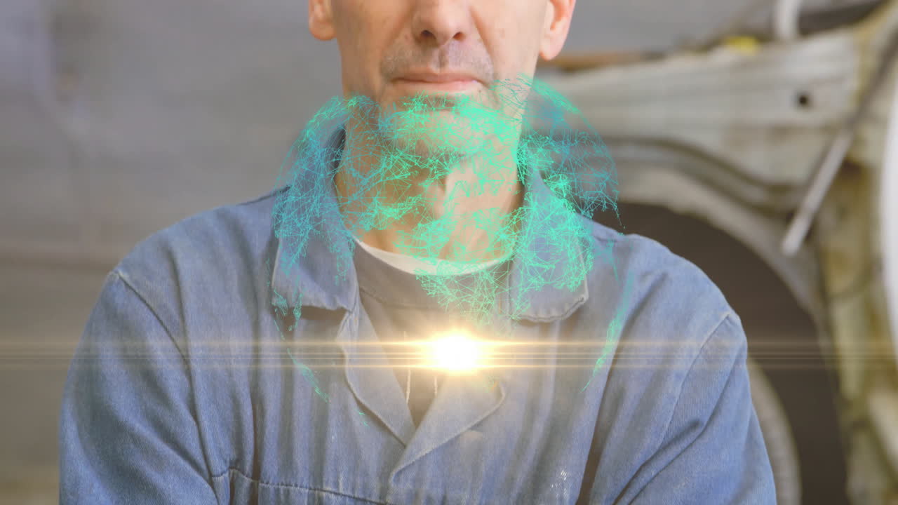 Male mechanic standing in auto garage displaying turquoise hologram and flare glowing at chest