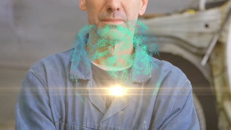 male mechanic standing in auto garage displaying turquoise hologram and flare glowing at chest