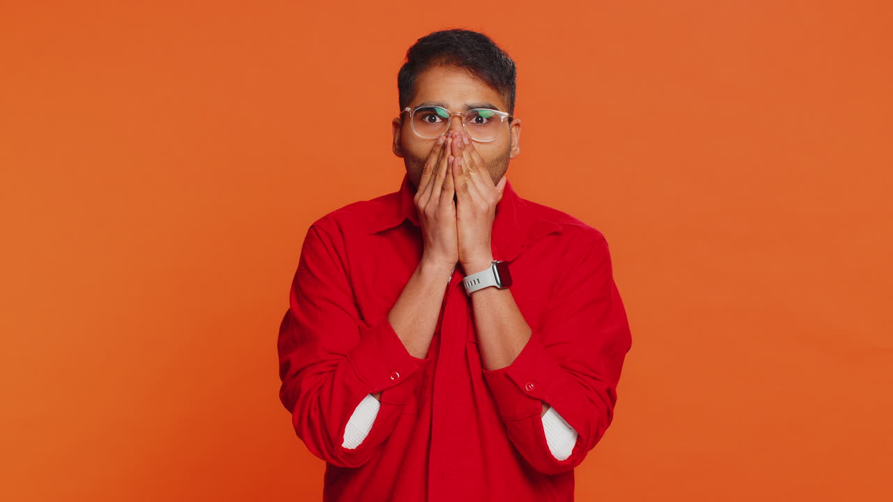 Scared fearful depressed indian man suffering phobia anxiety disorder expresses fear stress panic