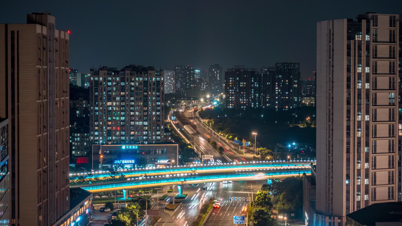 Night Cityscape with Illuminated Highway and Light Trails