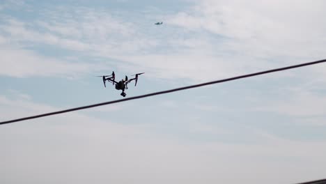 drone inspecting distribution pole, power pole