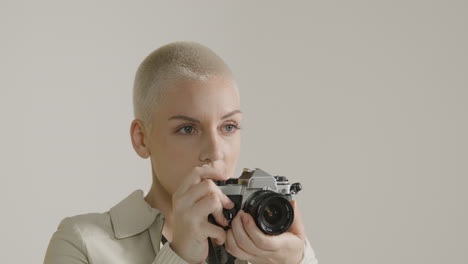 Woman-takes-photograph-on-vintage-camera-02