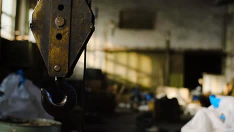 rusty crane hook in an abandoned factory