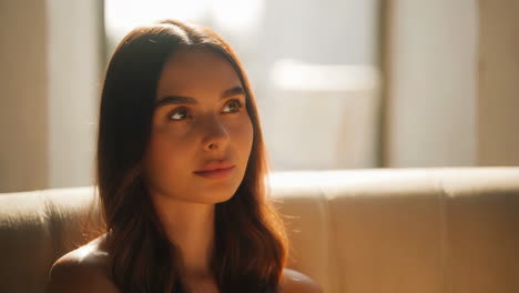 portrait of a thoughtful woman bathed in warm light