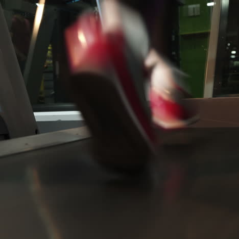 female muscular feet in sneakers running on the treadmill at the gym. concept for fitness, exercising and healthy lifestyle. square video