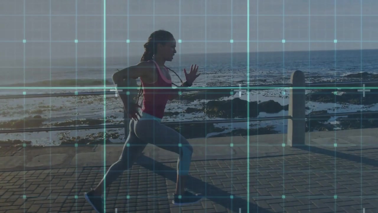 Vertical video: Running woman starting training run along coastal path, grid overlay and red top