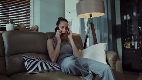 woman having a phone call at home