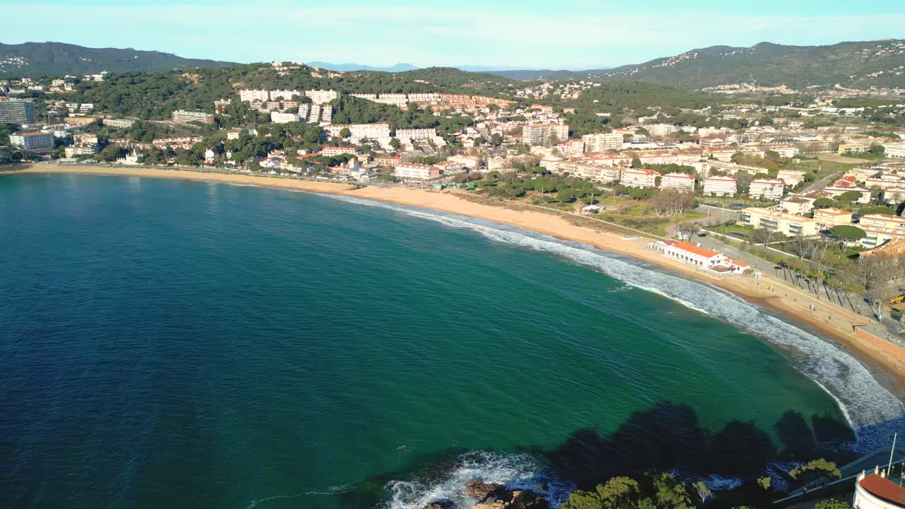 Turquoise water laps gently at the sandy beach of cavalaire-sur-mer